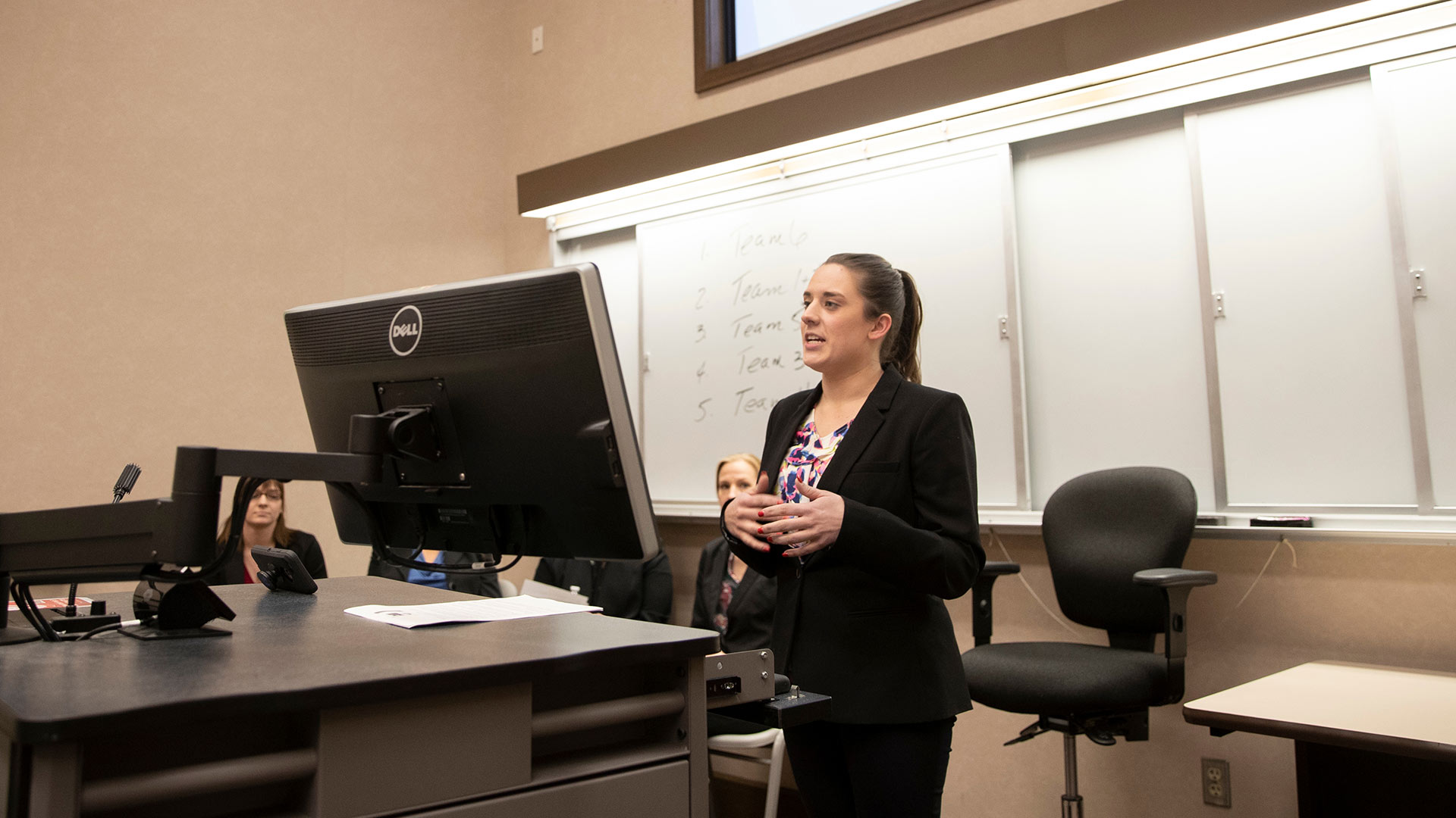 Health professions administrative leadership student making presentation